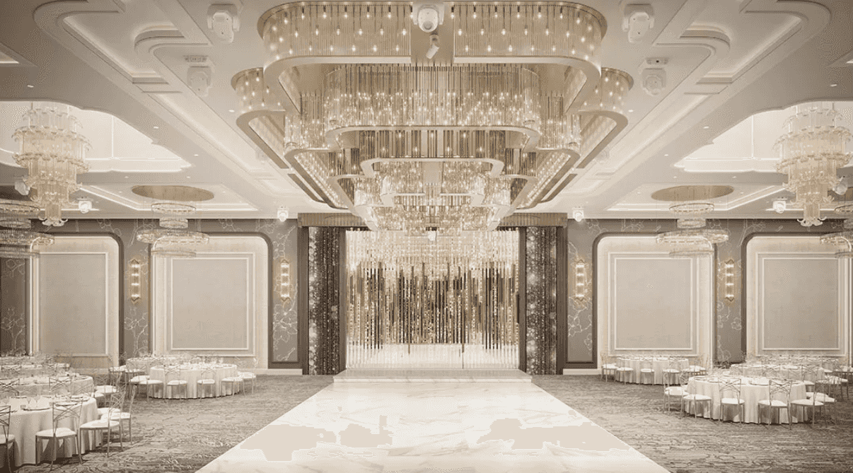 Elegant banquet hall with crystal chandeliers, white marble floor, and ornate décor, perfect for luxury events.